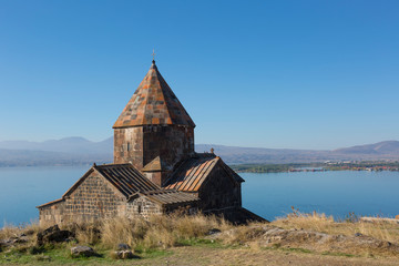 Scenic view of an old Sevanavank church in Sevan, Armenia on sunny  day, blue sky