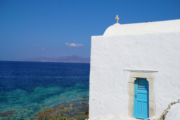 Picturesque view of the Mykonos sea with a church