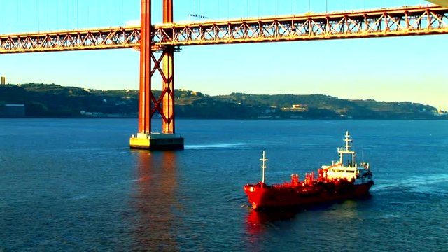Freighter under LIsbon Golden Gate Bridge