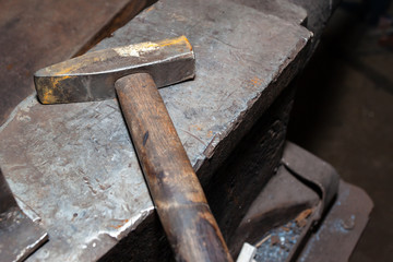 hammer on the anvil in the forge