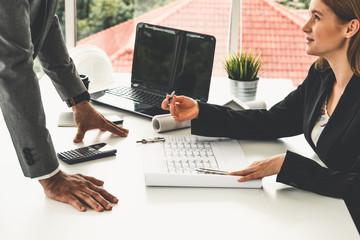 Architect and engineer working with construction drawing project on table in office. Architecture...