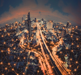 Digital network connection lines of Sathorn road, Bangkok Downtown, Thailand. Financial district...