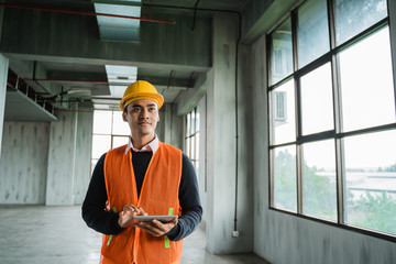 young asian engineer doing inspection on project installation