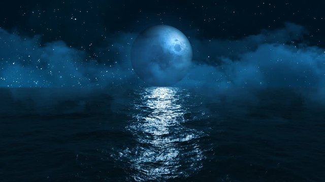 the moon touches the surface of the dark blue ocean at its reflection on the horizon against the sky