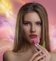 Beauty portrait of young woman with flower . Model girl with professional make-up and Nail art manicure over pink background.