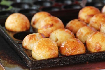 Takoyaki is delicious Japanese food on pan