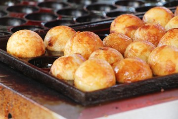 Takoyaki is delicious Japanese food on pan