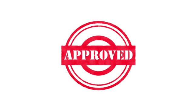 Animated video of a traditional rubber stamp imprinting an ink circle sign with the word APPROVED