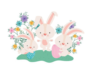 easter rabbits with eggs and flowers icon