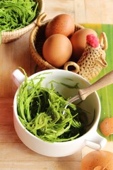 Making fried acacia pennata omelette is delicious