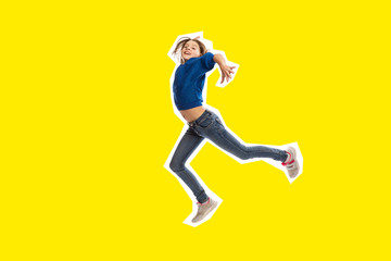 Fototapeta na wymiar Cute teen girl in high jump, yellow background