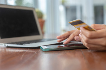business owner young Muslim woman wearing hijab working with laptop on a white desk, entrepreneur ready to welcome customers with confidence for success,  The concept: small shop service retail