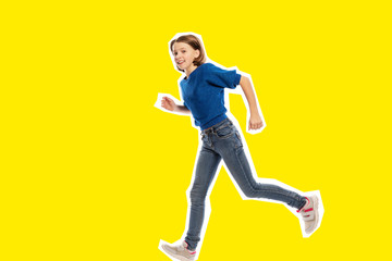 Fototapeta na wymiar Running cute teen girl, yellow background