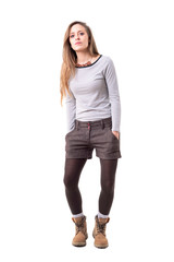 Cool funky stylish millennial hipster girl dancing slowly with hands in pockets. Full body isolated on white background. 