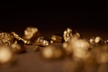 selective focus of golden stone on black background