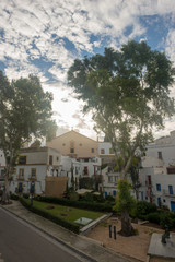Fototapeta na wymiar White houses around the town of Ibiza