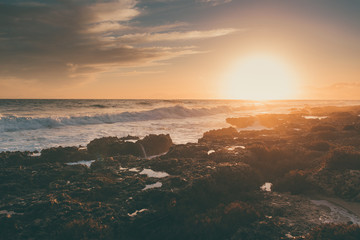 Amazing beach sunset with beautiful sunset and incredible foamy waves