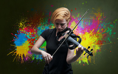 Young classical violinist musician with colorful splotch wallpaper
