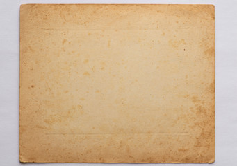tight very old sheet of paper on an isolated white background