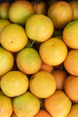 Closed shot of fresh oranges stacked ready to eat
