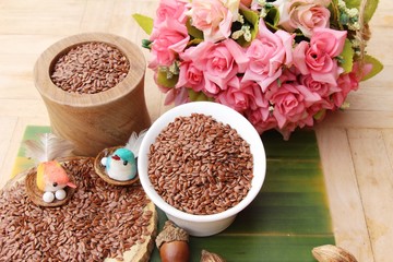 Flax seeds for health on wood background