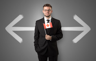 Handsome young boy choosing target country with arrows on the background
