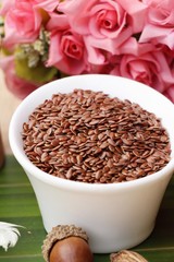 Flax seeds for health on wood background