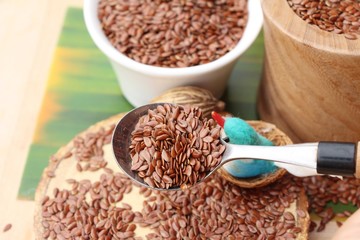 Flax seeds for health on wood background
