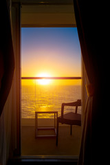 View of the sunset from the cabin of a cruise liner