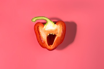Sliced natural organic red bulgarian bell pepper on trend pink background.Top view.Healthy food concept. Flat lay.Copy space. Minimalism style.Vegetables Vitamins Rustic Style. 