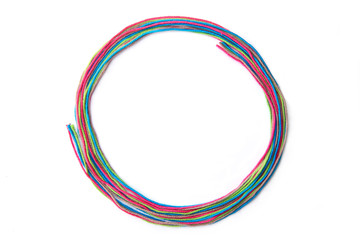 Colorful circle frame made of thread isolated on white background. Empty frame of cotton thread.
