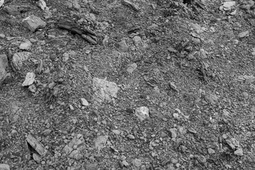 Gray abstract background of limestone stones and crumbs