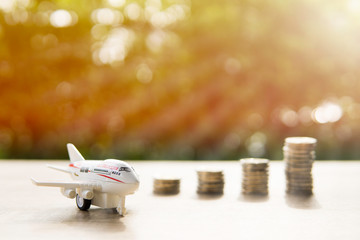 Airplane and coins Show savings for travel. Or saving to study abroad.