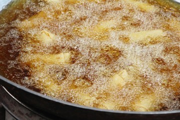 fried spring rolls in pan at street food
