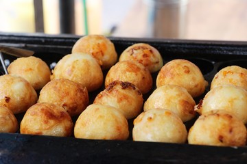 Takoyaki is delicious Japanese food on pan