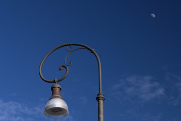 Fototapeta na wymiar street lamp on blue sky,urban,illumination,antique,metal,old,lantern,lighting