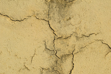 Fancy background and texture.Cobweb of cracks on the old wall.Centuries-old plaster,medieval Europe.