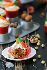 Easter cupcakes baked with carrot decorated with small figures