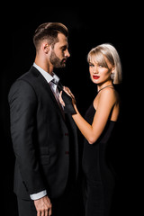 attractive glamour couple posing isolated on black
