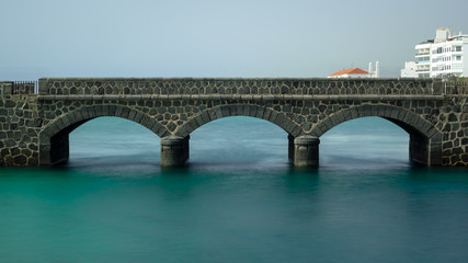 Fototapeta premium Bridge to the San Gabriel castle in Arrecife, Lanzarote. Long exposure.