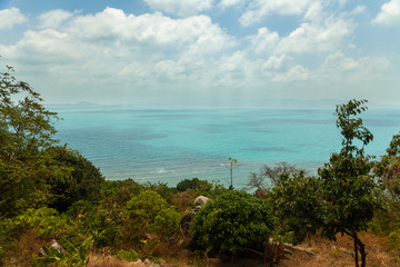 Fototapeta na wymiar Beautiful sea view with green coastline in the tropics