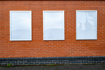 Fototapeta premium Blank advertising posters on outside shop wall
