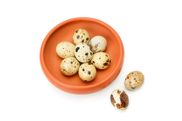 Guail eggs in bowl isolated on white background.