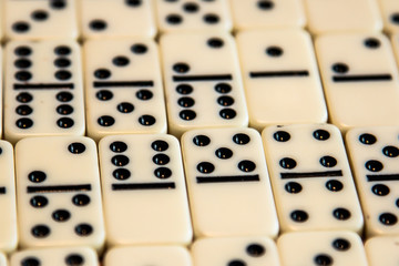 Various Dominos in a pattern lying down on a table