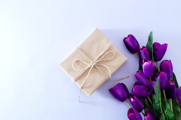 Fototapeta na wymiar Spring Purple tulip bouquet and gift box