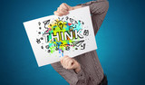 Young person holding paper with design thinking concept 
