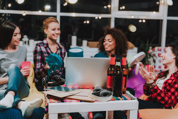Cheerful female company in home friendly party