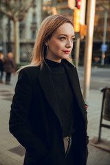 Portrait of blonde girl in Barcelona city