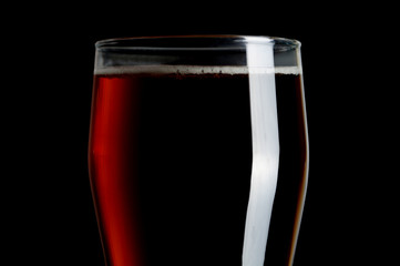 glass of beer isolated on black