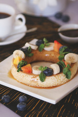 Coffee mousse served with fruits and berries